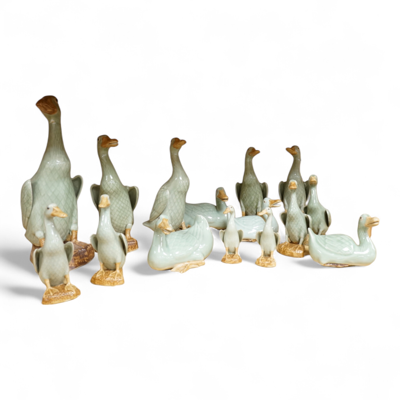 A collection of Chinese celadon glazed models of geese and ducks, largest 31cm high